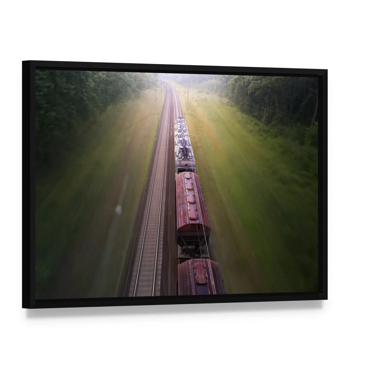 Freight Train Travels Through Foggy Forest Canvas Wall Art, framed canvas in a black floater frame, angled product view