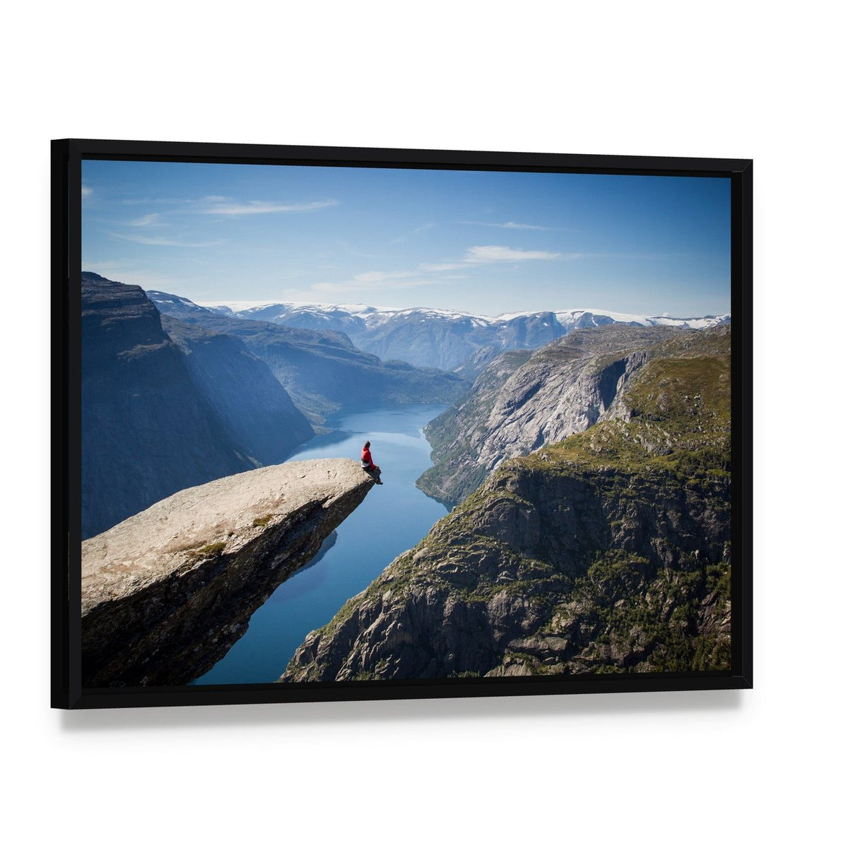 Person on Trolltunga During Daytime Canvas Wall Art, framed canvas in a black floater frame, angled product view