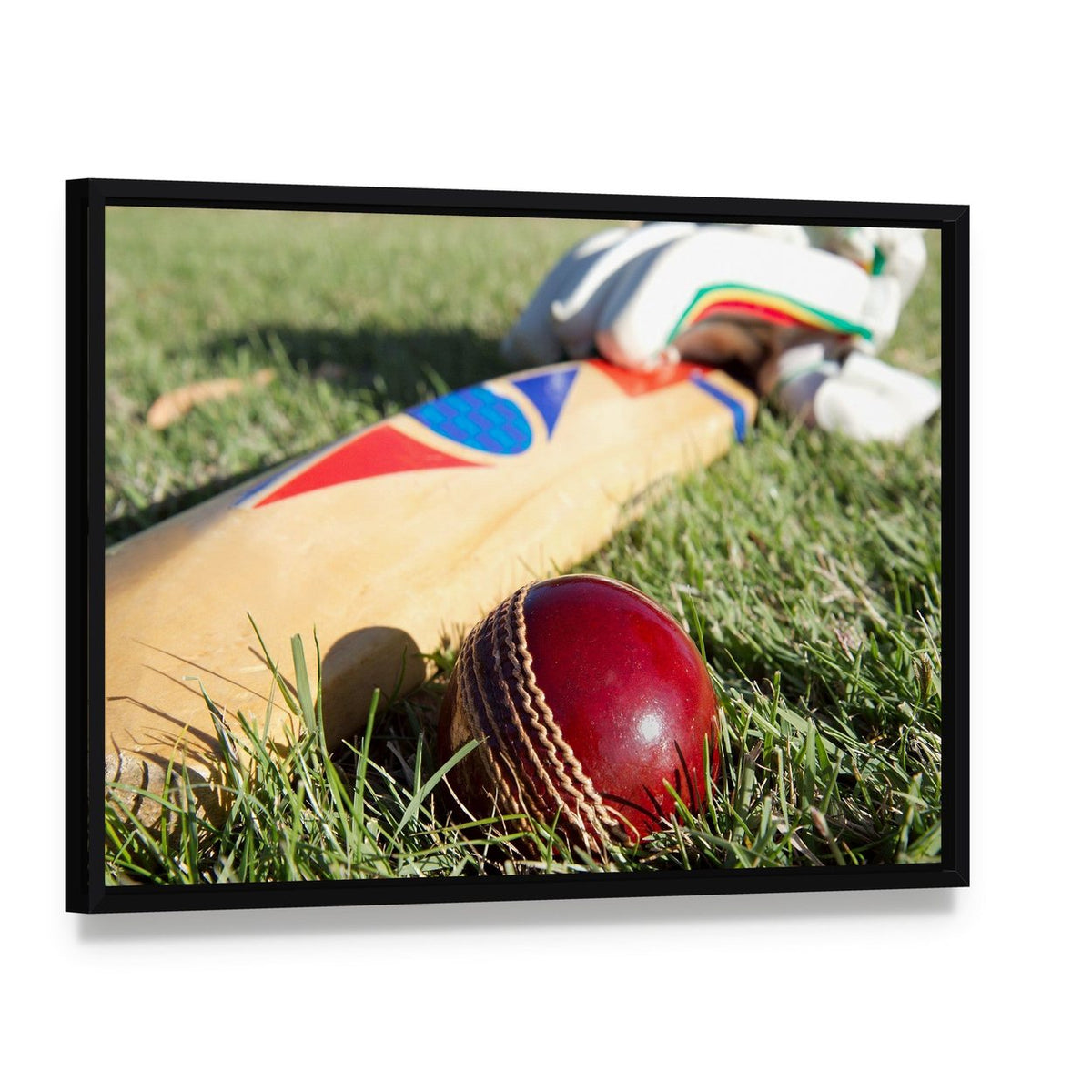 Cricket Ball Bat & Gloves Canvas Wall Art, framed canvas in a black floater frame, angled product view
