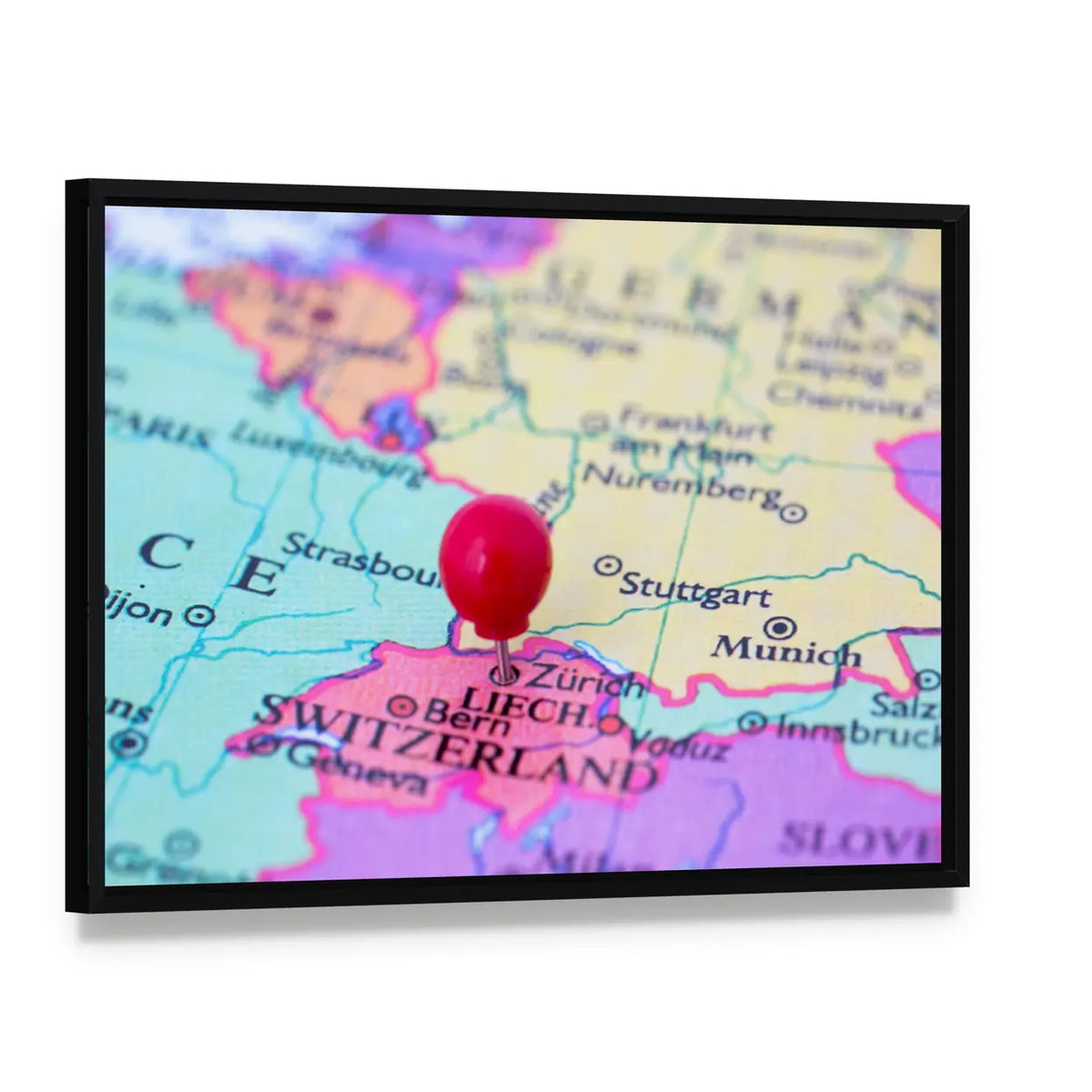 Red Pushpin on Map of Switzerland Canvas Wall Art, framed canvas in a black floater frame, angled product view