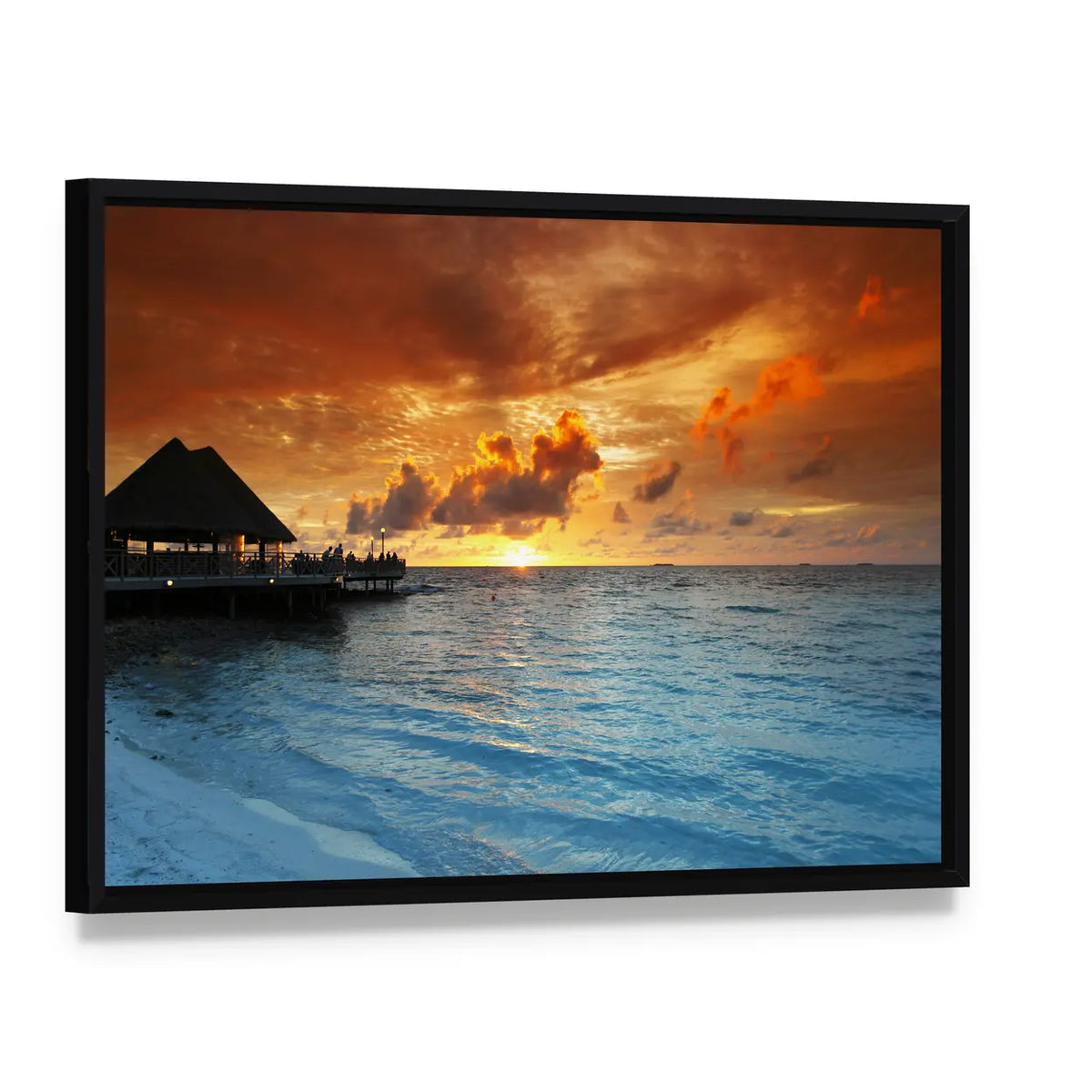 Maldives Thatched Hut on Pier at Sunset Canvas Wall Art, framed canvas in a black floater frame, angled product view