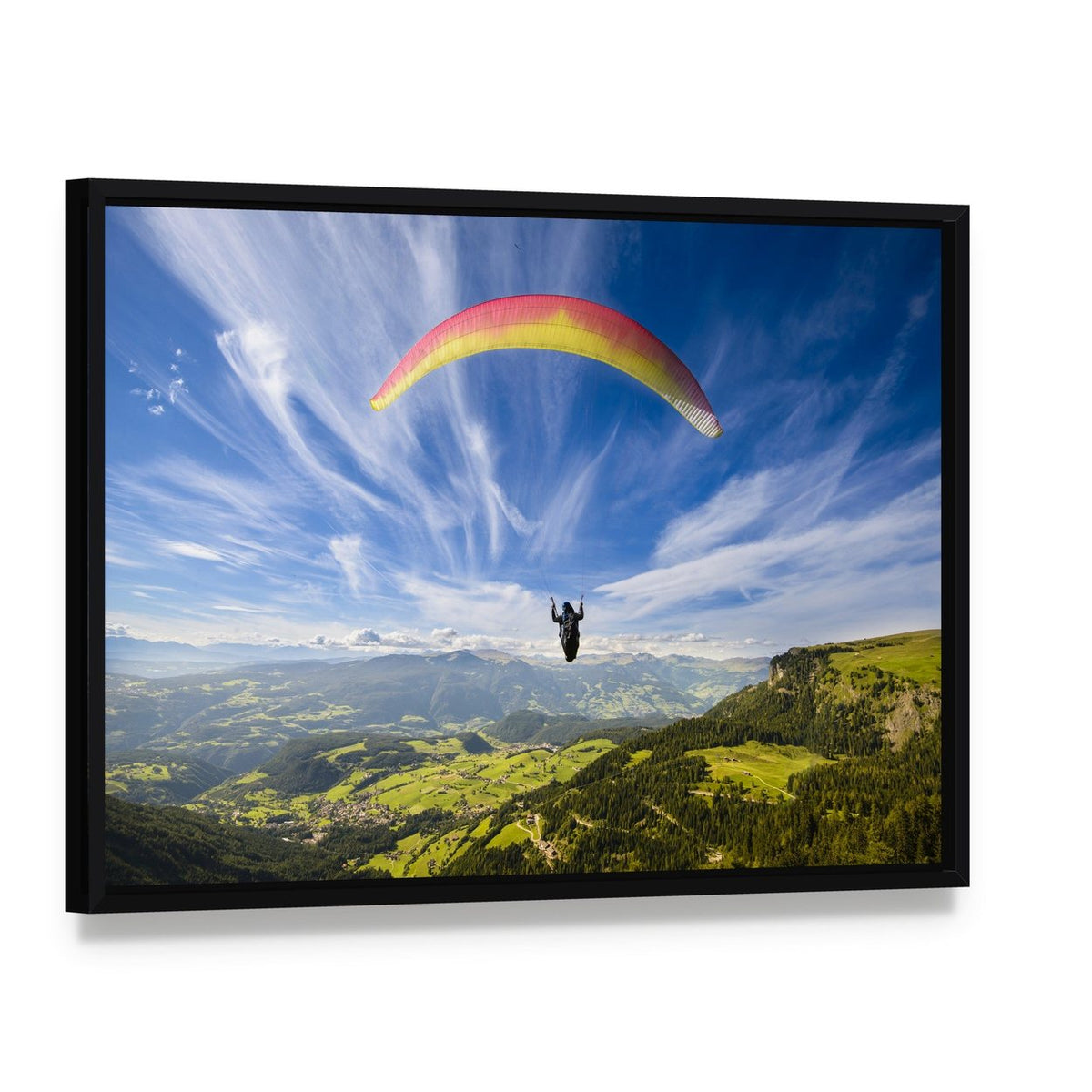 Paraglider Flying Over Mountains Canvas Wall Art, framed canvas in a black floater frame, angled product view