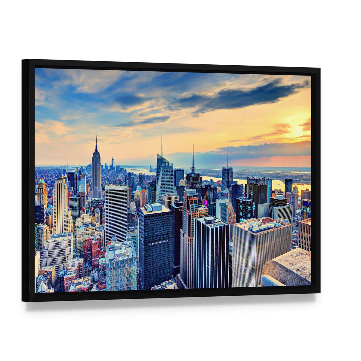 New York City Skyline at Dusk Canvas Wall Art, framed canvas in a black floater frame, angled product view
