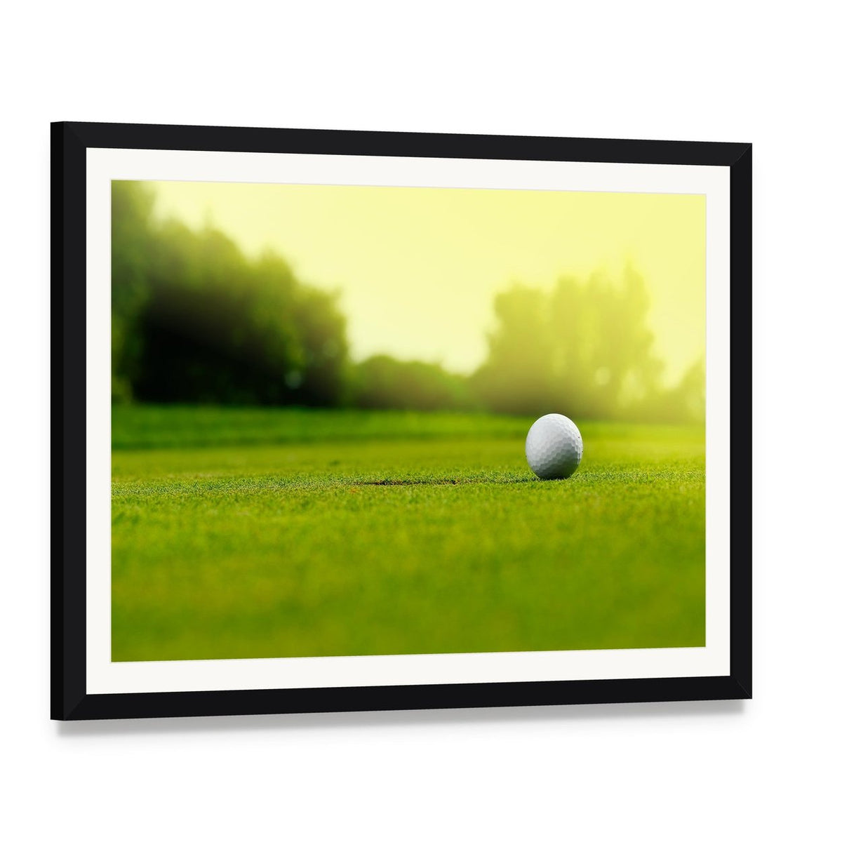 Golf Ball in the Hole Canvas Wall Art, framed print with white mat and black frame, angled product view