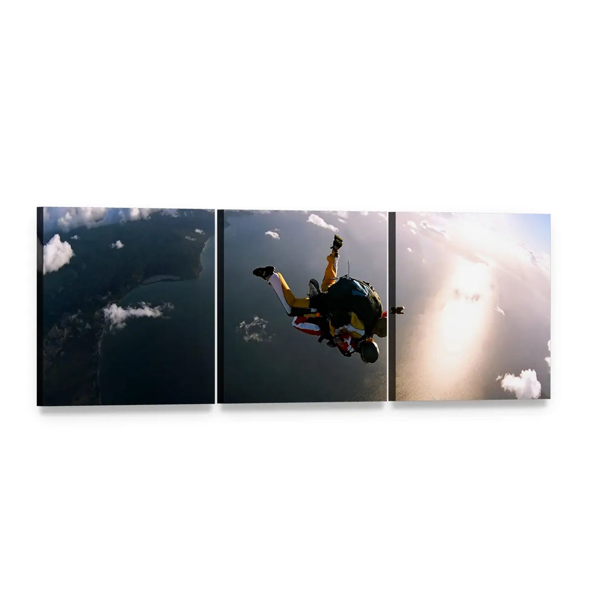 Tandem Skydivers Over Sunlit Coastline Panoramic Canvas Wall Art, 3 panel 3 Piece layout gallery wrapped canvas set, angled product view