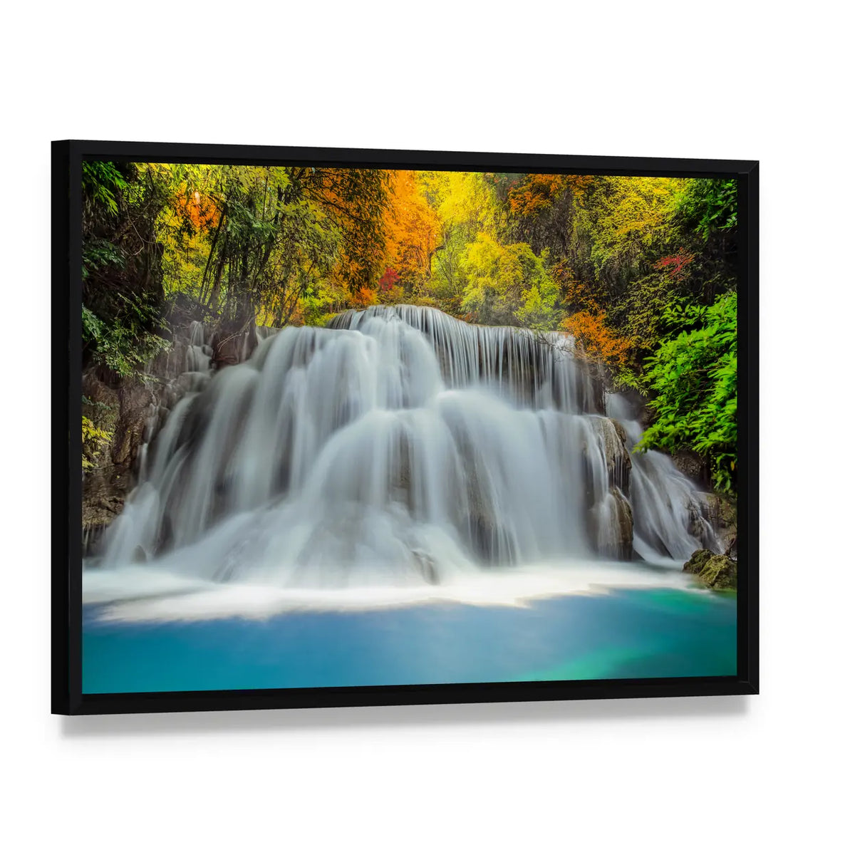 Tropical Waterfall In Thailand Canvas Wall Art, framed canvas in a black floater frame, angled product view