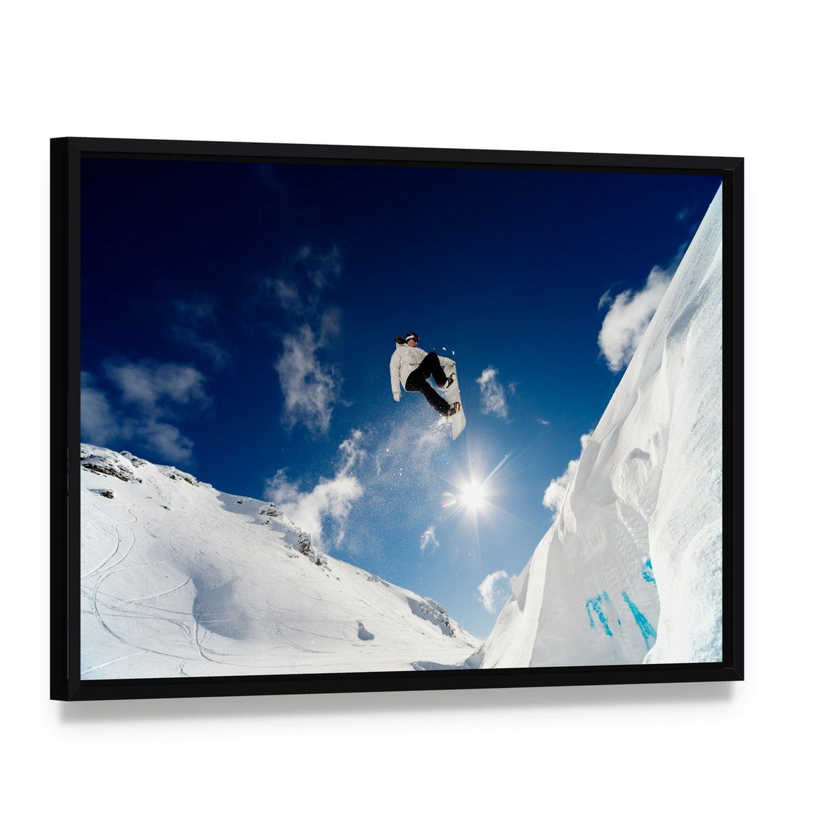 Snowboarder Jumping Through the Air Canvas Wall Art, framed canvas in a black floater frame, angled product view