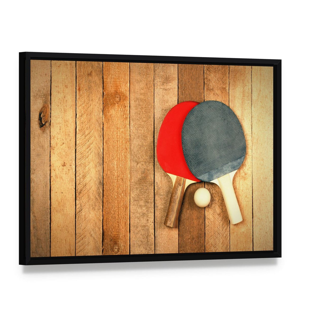 Table Tennis Paddles and Ball Canvas Wall Art, framed canvas in a black floater frame, angled product view
