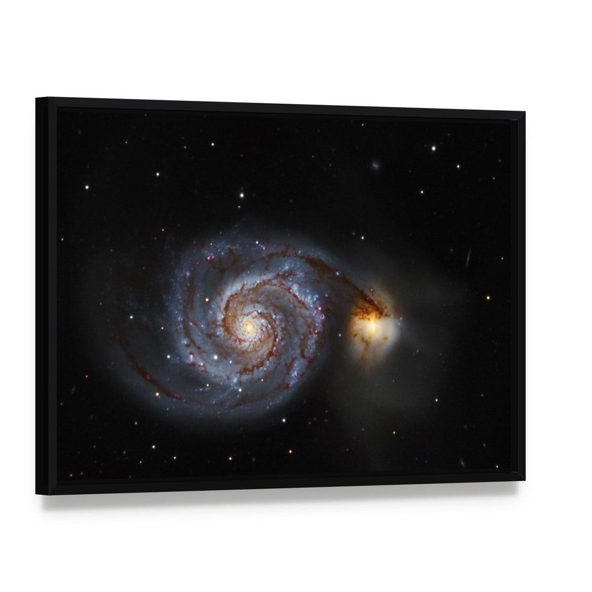 The Whirlpool Galaxy Canvas Wall Art, framed canvas in a black floater frame, angled product view