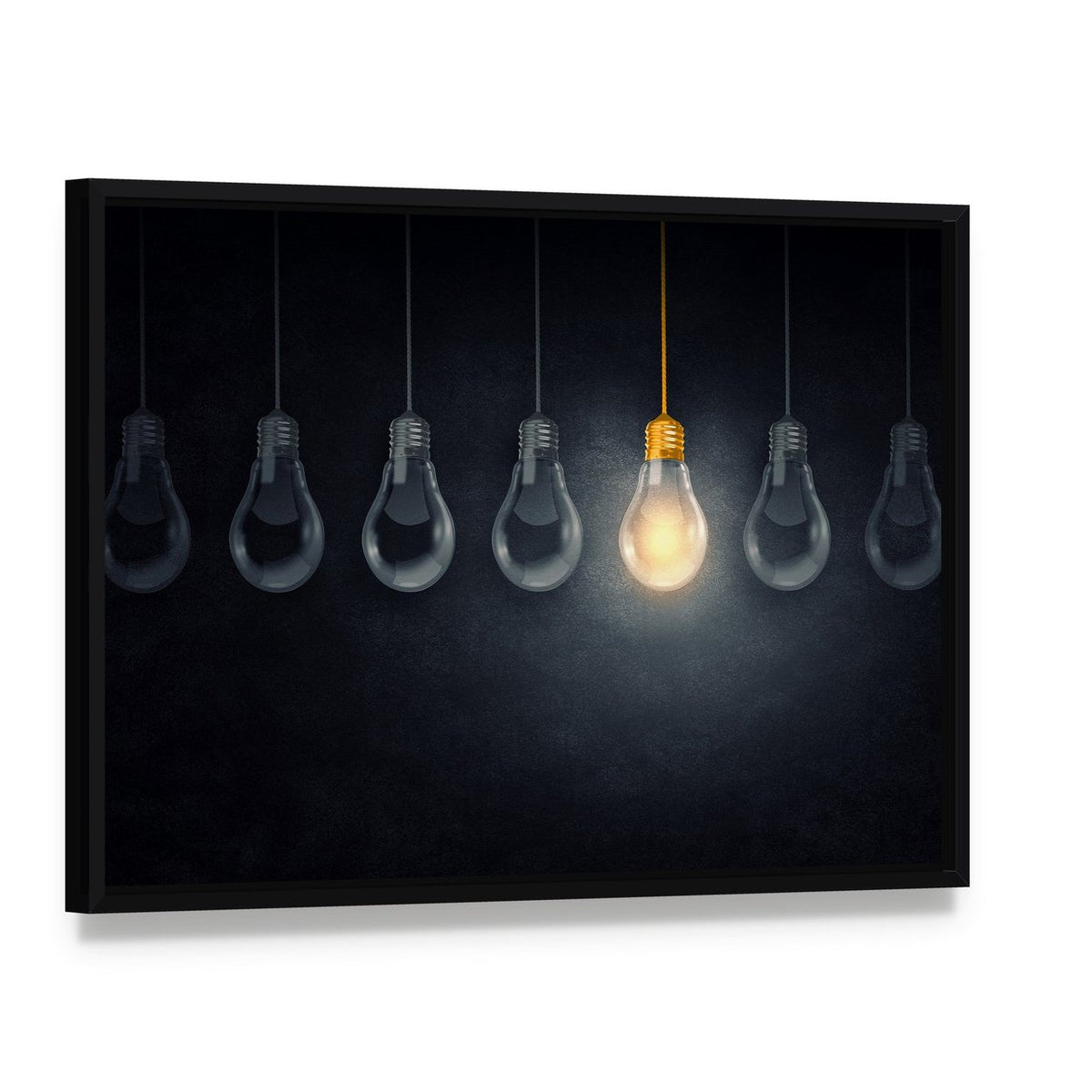 One Lit Lightbulb Among Many Canvas Wall Art, framed canvas in a black floater frame, angled product view