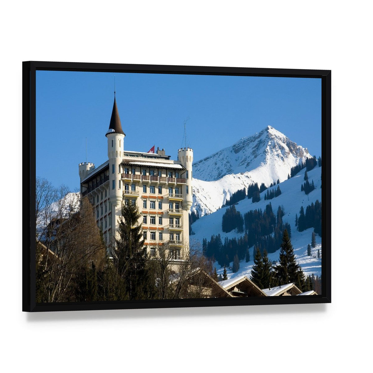 Gstaad Hotel in Switzerland Canvas Wall Art, framed canvas in a black floater frame, angled product view