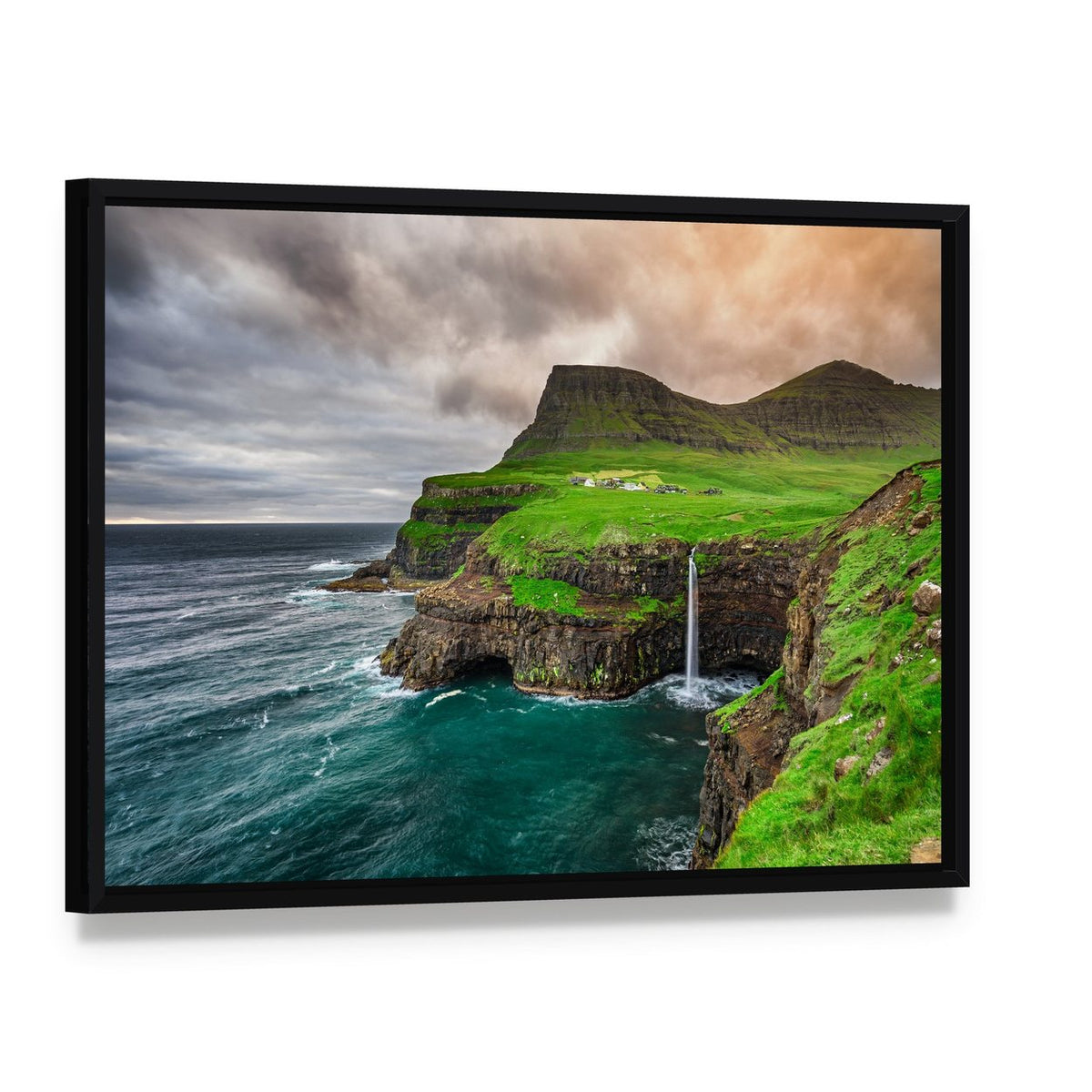 Mulafossur Waterfall and Coastal Village Canvas Wall Art, framed canvas in a black floater frame, angled product view