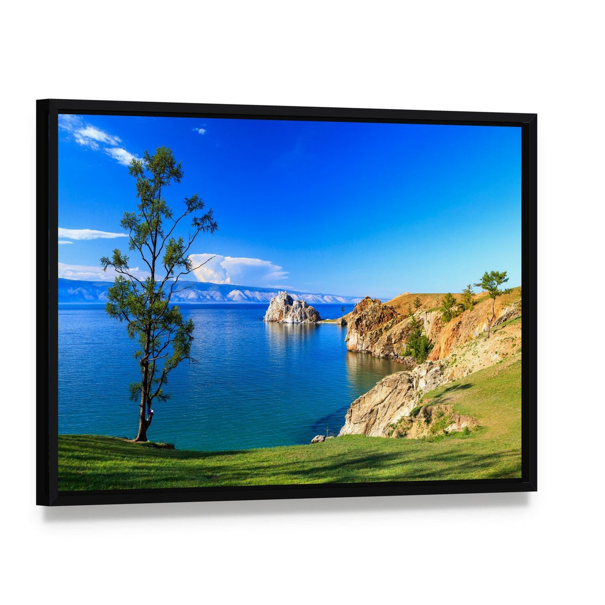 Lake Baikal with Lone Tree and Mountains Canvas Wall Art, framed canvas in a black floater frame, angled product view