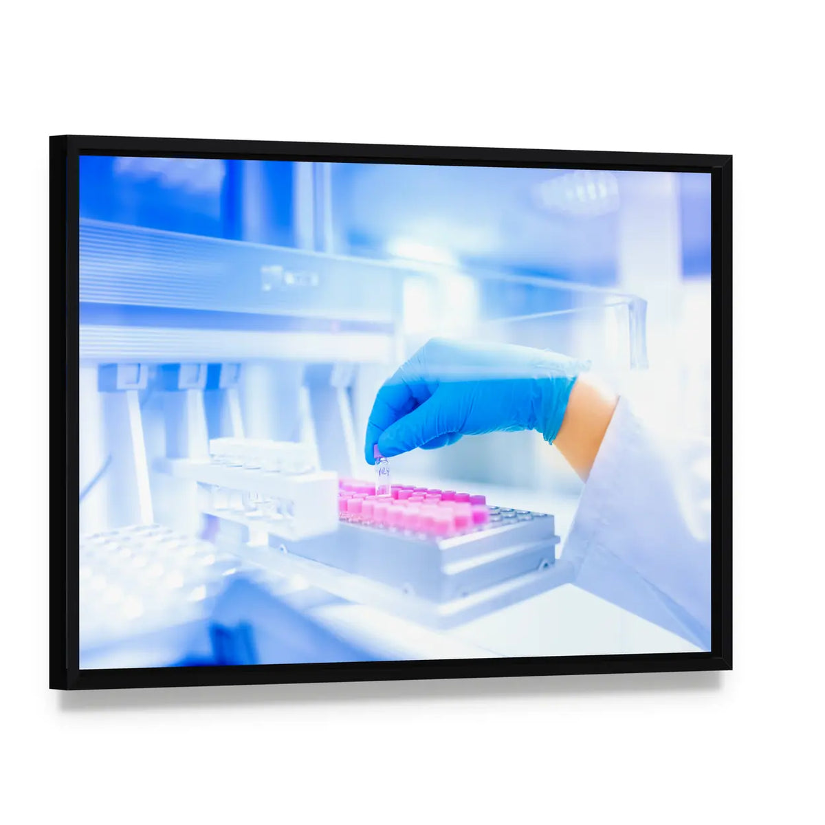 Hand Holding Vial in Medical Laboratory Canvas Wall Art, framed canvas in a black floater frame, angled product view