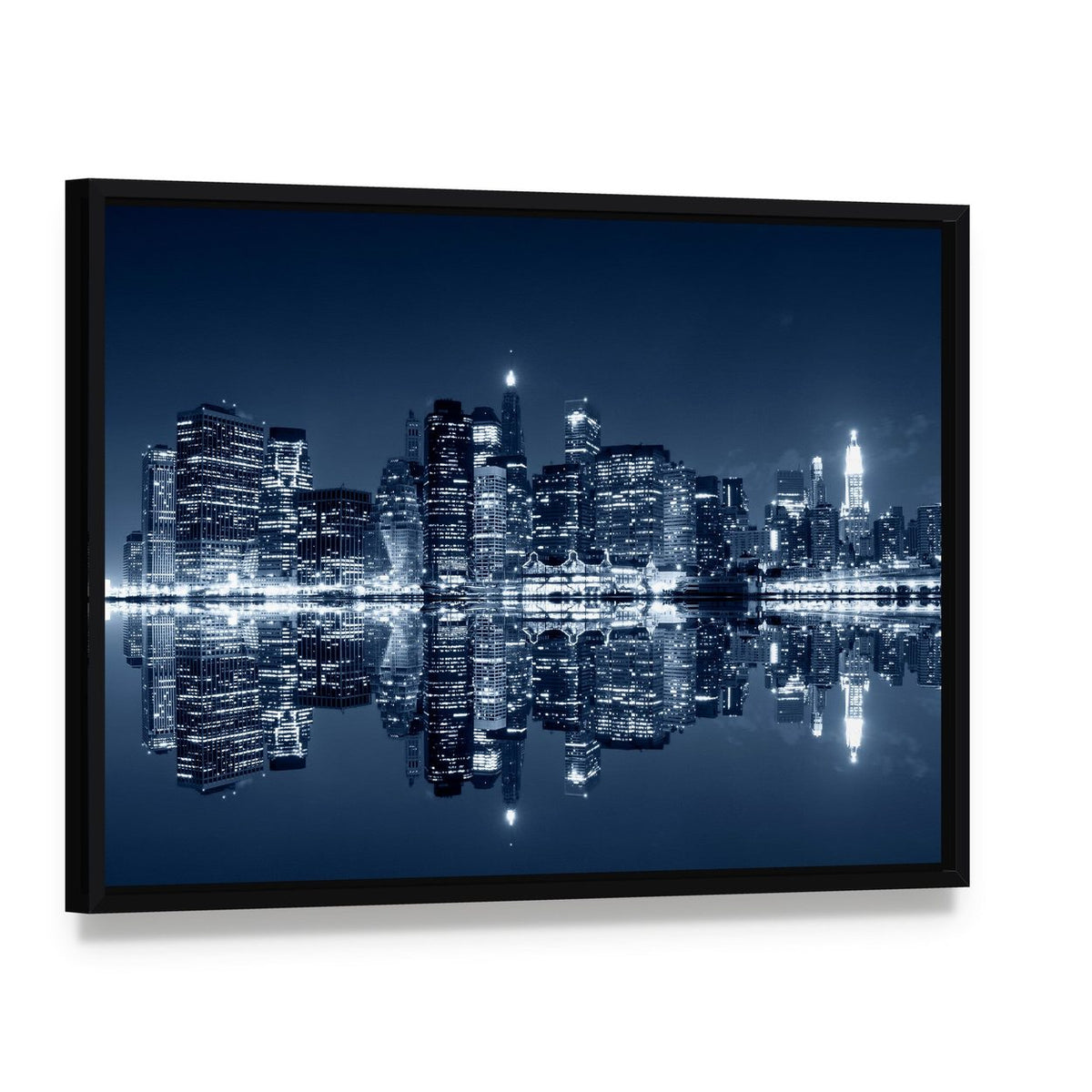 New York City Skyline at Night Canvas Wall Art, framed canvas in a black floater frame, angled product view