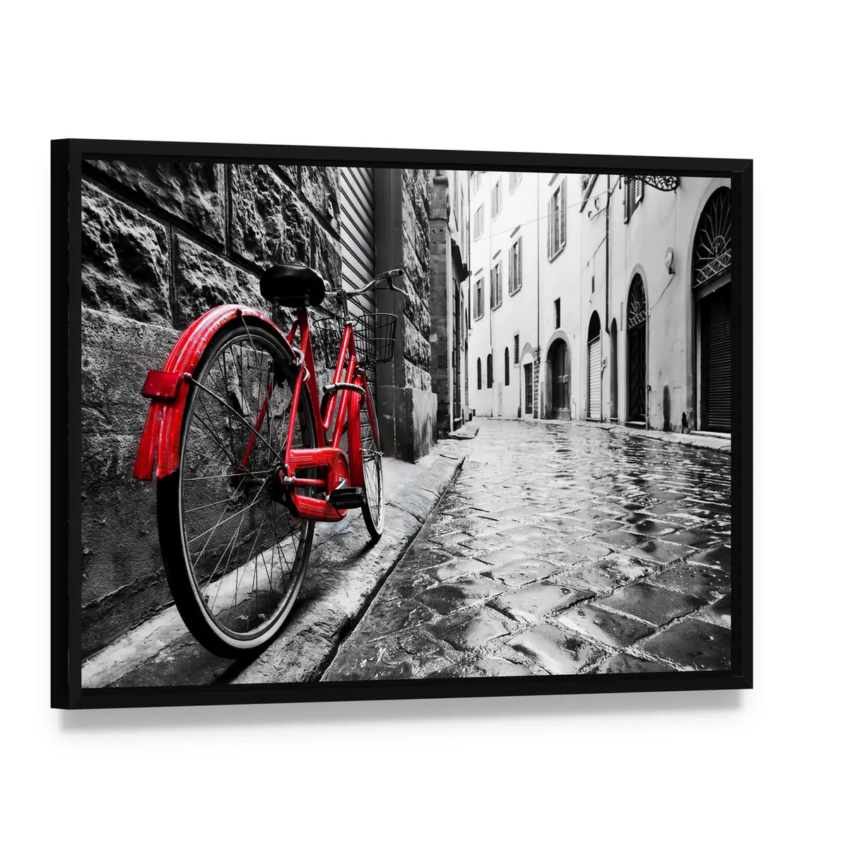 Red Bicycle on Cobblestone Street Canvas Wall Art, framed canvas in a black floater frame, angled product view