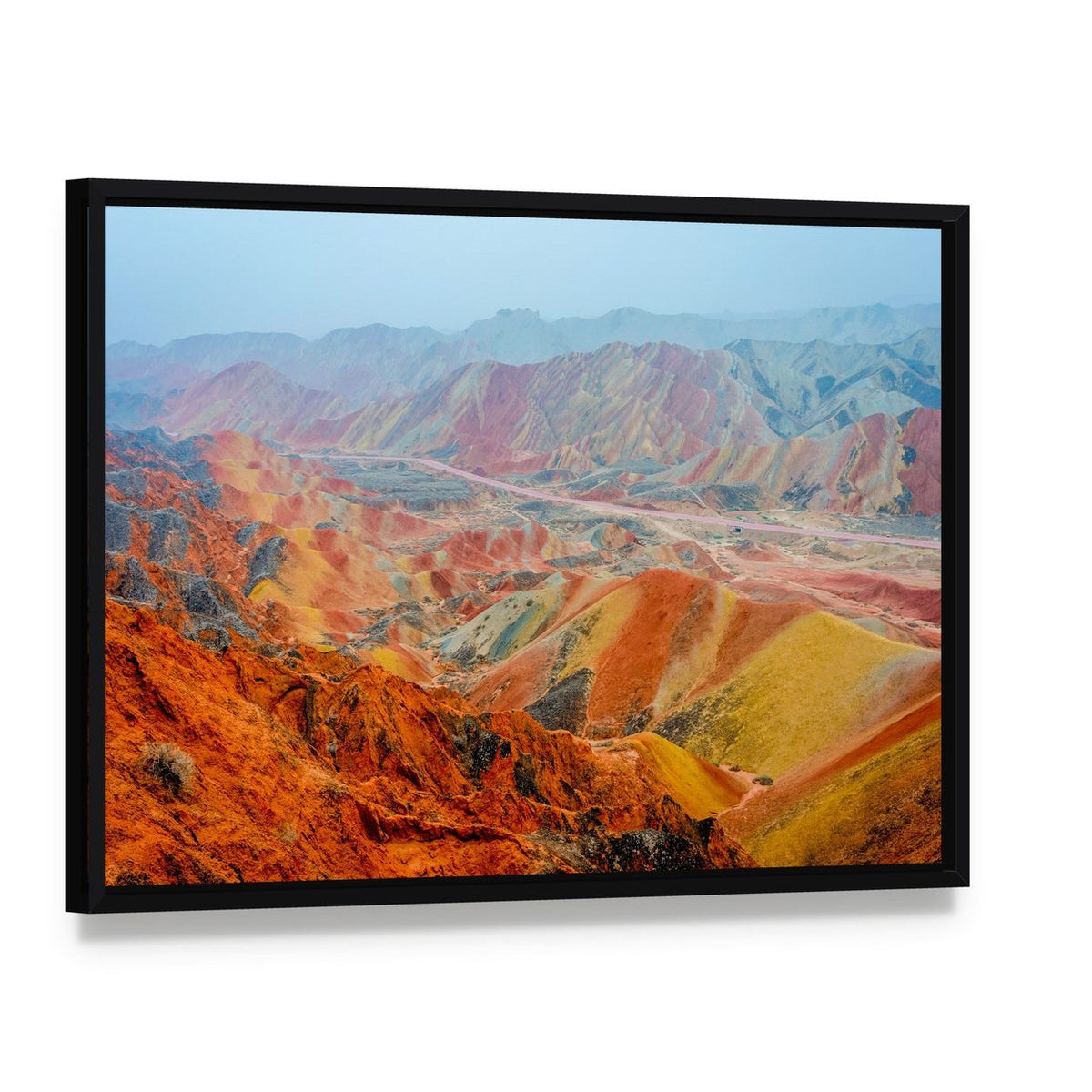 Vibrant Rainbow Mountain Landscape Canvas Wall Art, framed canvas in a black floater frame, angled product view