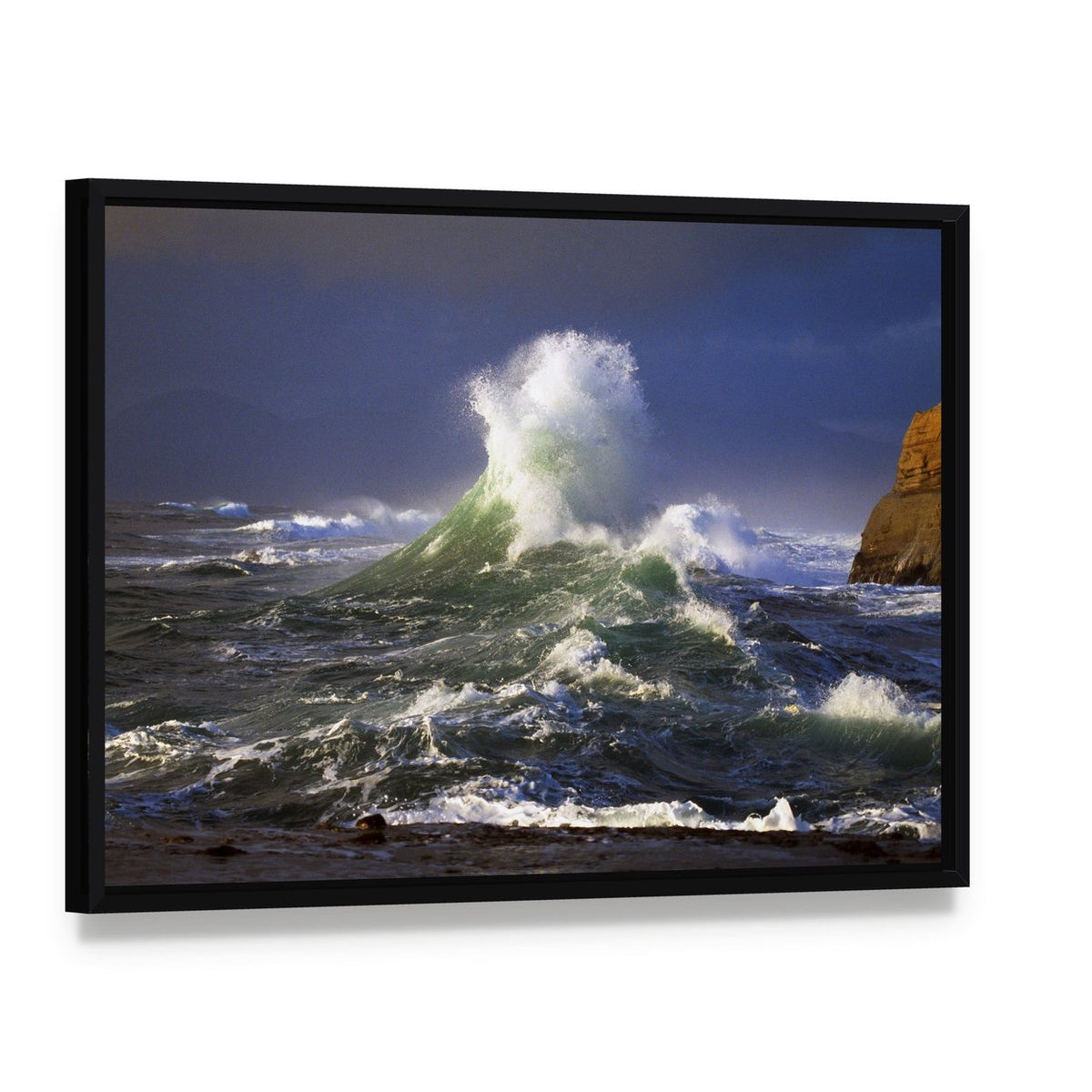 Wave Crashing Distant Storm Cape Kiwanda Canvas Wall Art, framed canvas in a black floater frame, angled product view
