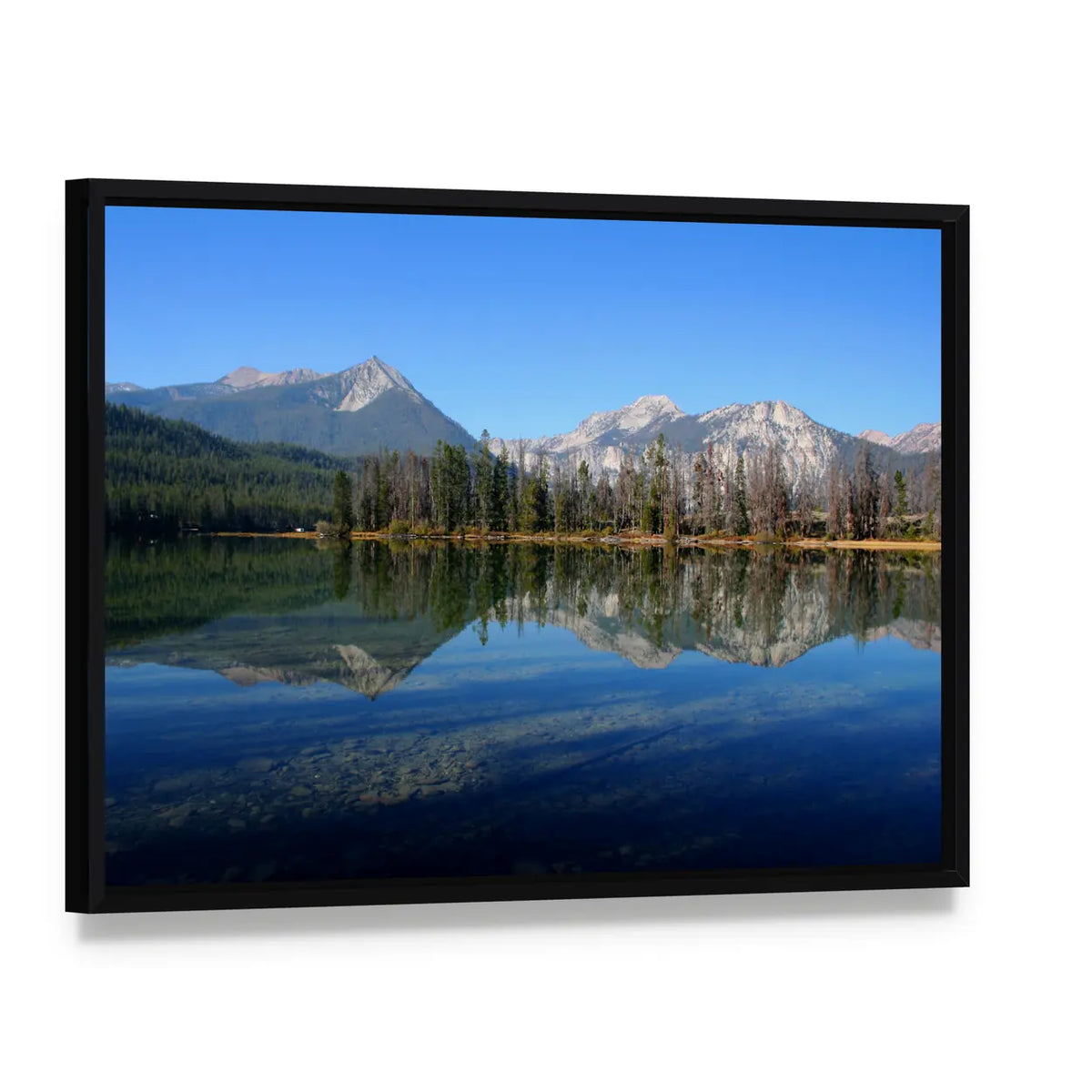 Lake and Sawtooth Mountain Canvas Wall Art, framed canvas in a black floater frame, angled product view
