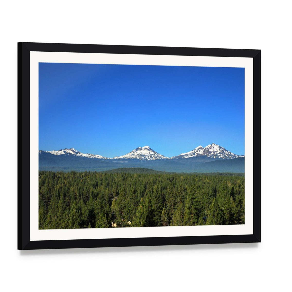 Three Sisters Mountains Oregon Canvas Wall Art, framed print with white mat and black frame, angled product view