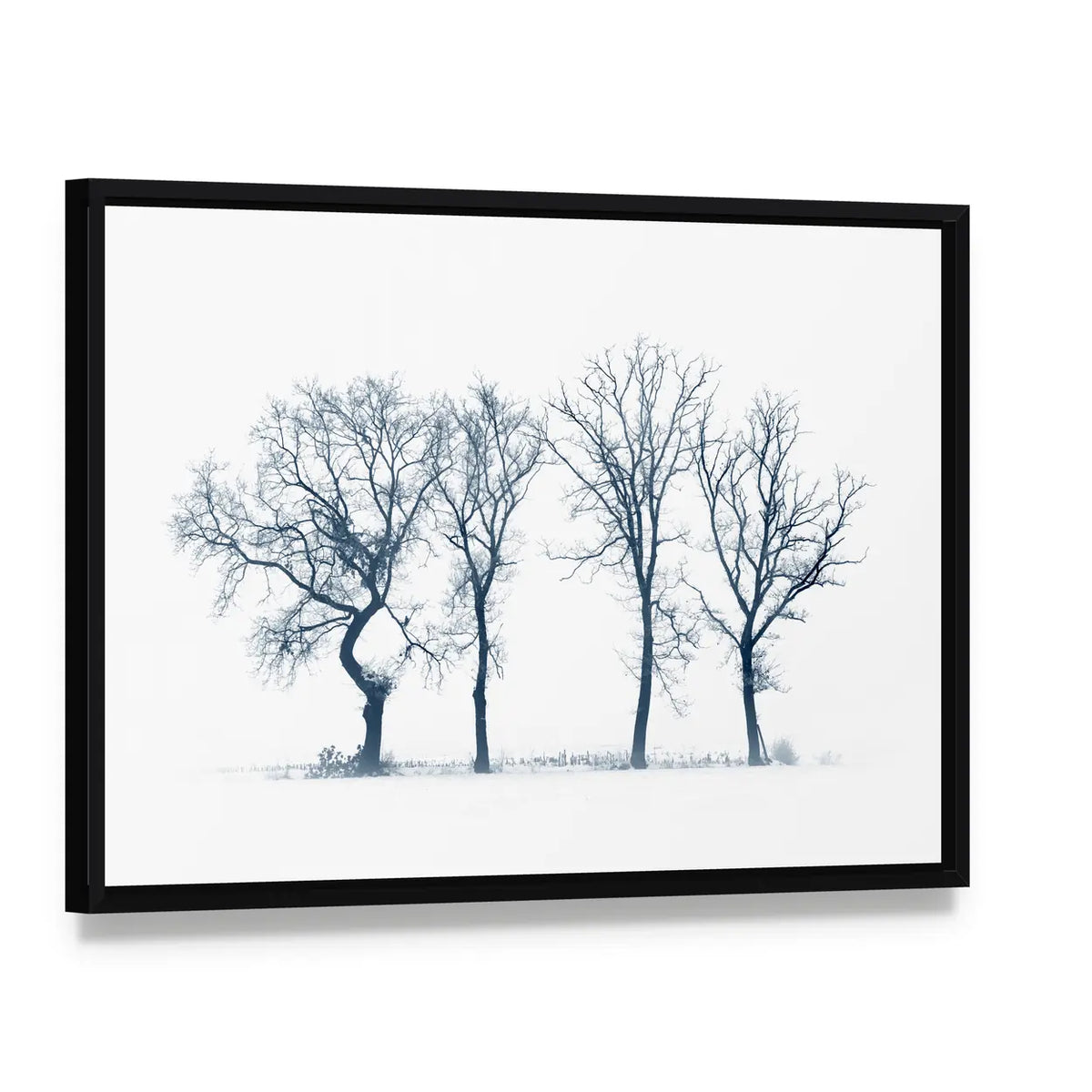 Four Bare Trees in Winter Canvas Wall Art, framed canvas in a black floater frame, angled product view