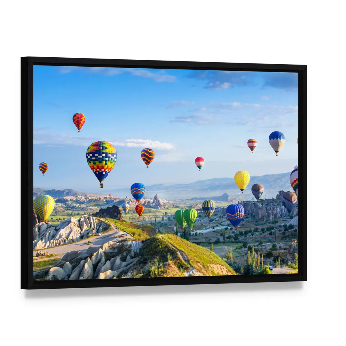 Hot Air Balloons Over Cappadocia Canvas Wall Art, framed canvas in a black floater frame, angled product view