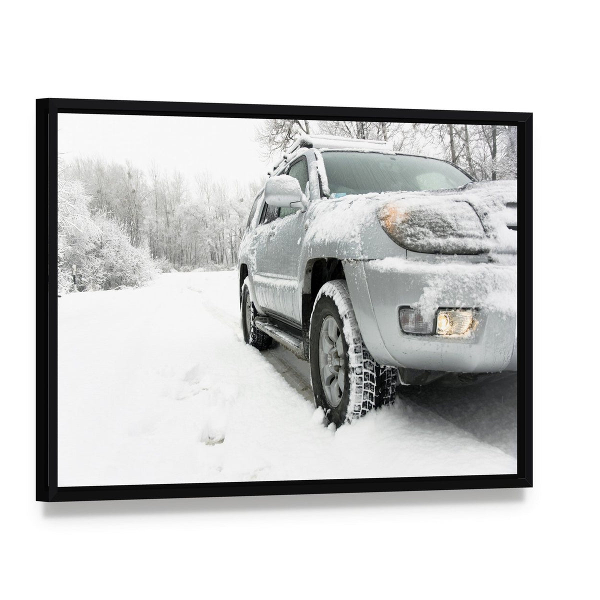 Snowy Winter Road Behind Car Canvas Wall Art, framed canvas in a black floater frame, angled product view