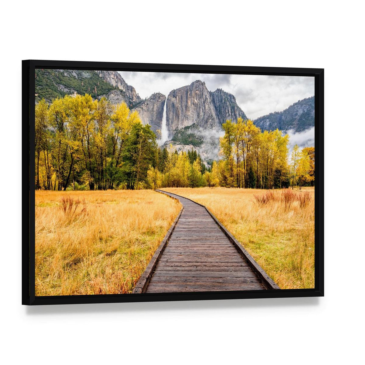 Boardwalk Through Autumn Foliage Canvas Wall Art, framed canvas in a black floater frame, angled product view