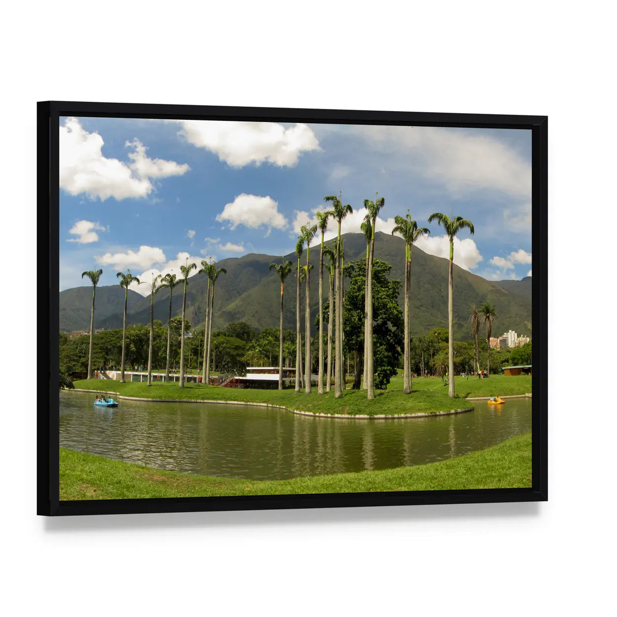 Palm-lined Mountain Lake with Two Boats Canvas Wall Art, framed canvas in a black floater frame, angled product view