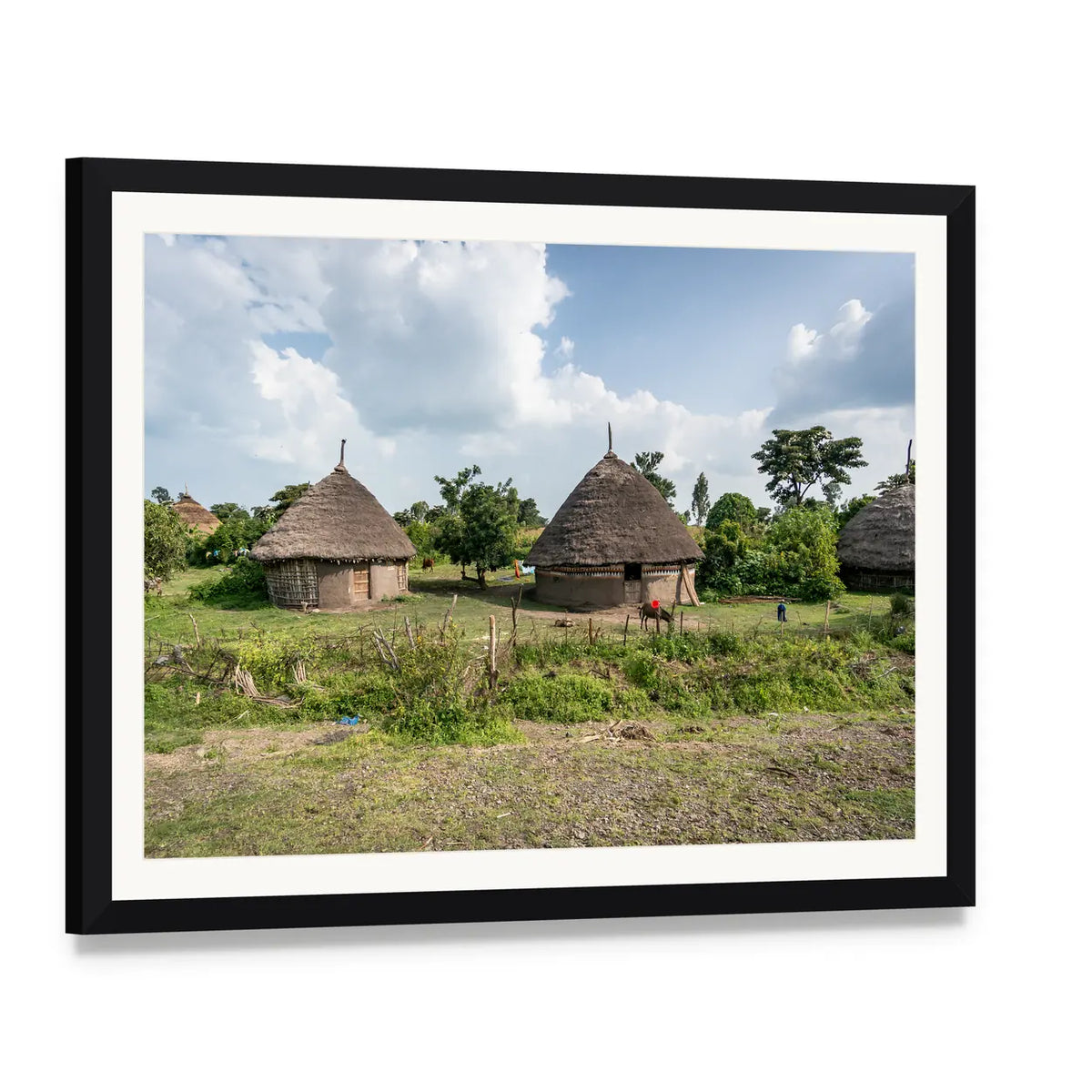 Omo Valley Straw Huts Canvas Wall Art, framed print with white mat and black frame, angled product view