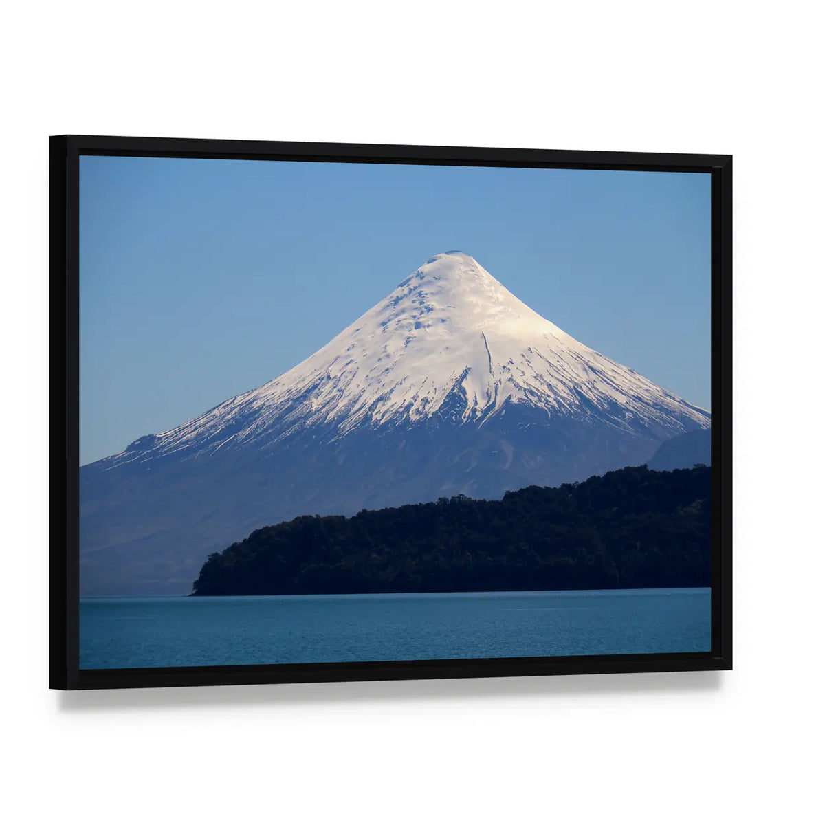 Snow-capped Volcano Over Calm Lake Canvas Wall Art, framed canvas in a black floater frame, angled product view