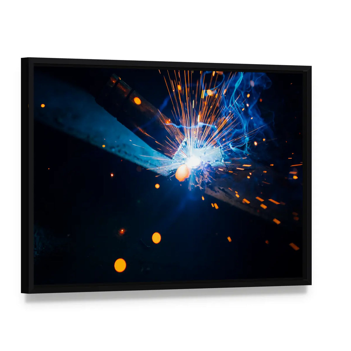 Welding Sparks with Blue Electric Arc Canvas Wall Art, framed canvas in a black floater frame, angled product view