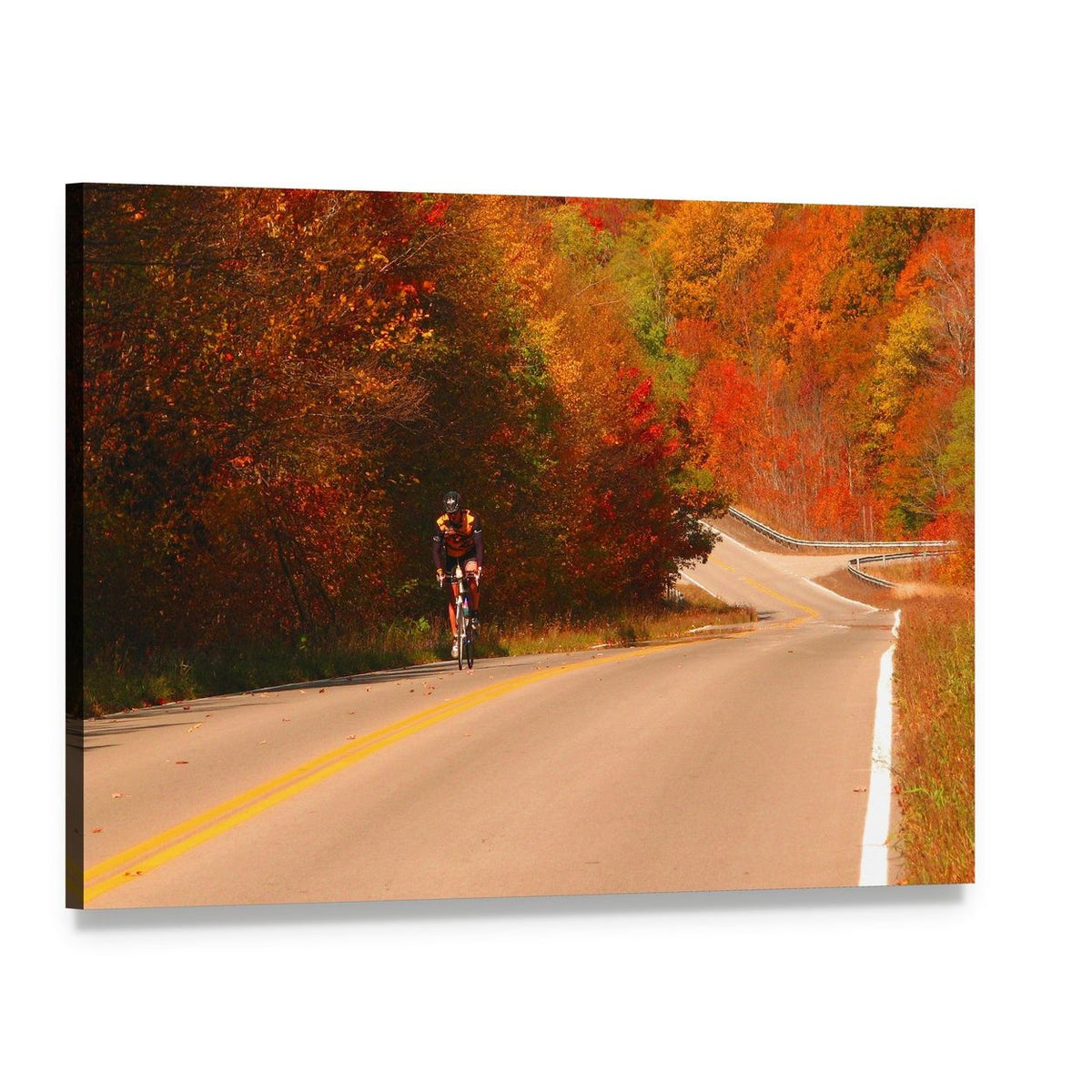 Cyclist on Winding Autumn Road Canvas Wall Art, single panel gallery wrapped canvas, angled product view