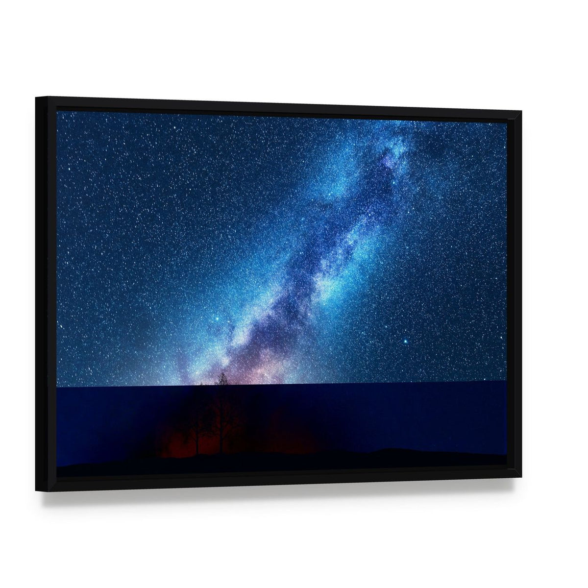 Milky Way Over Silhouetted Trees Canvas Wall Art, framed canvas in a black floater frame, angled product view
