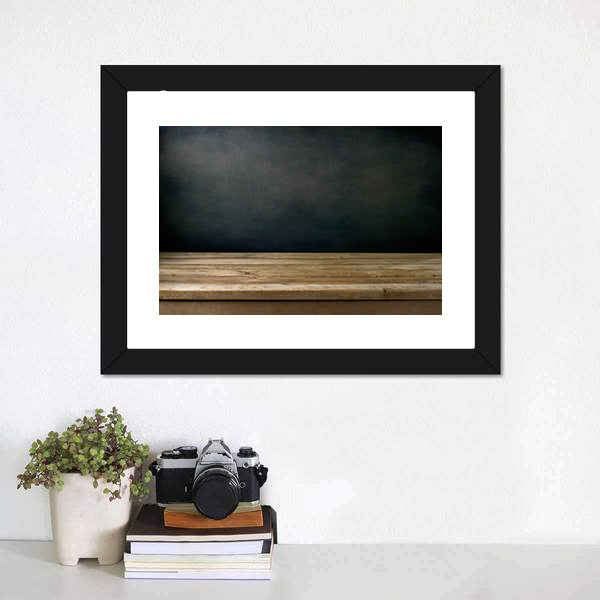 Wooden Table Against Grunge Black Canvas Wall Art