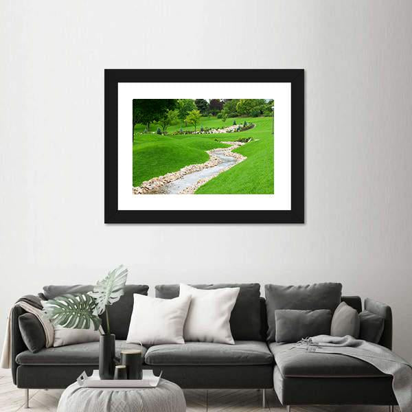 Stream Of Water Flowing Through Grassy Hills With Trees Canvas Wall Art-1 Piece-Framed Print-20" x 16"-Tiaracle
