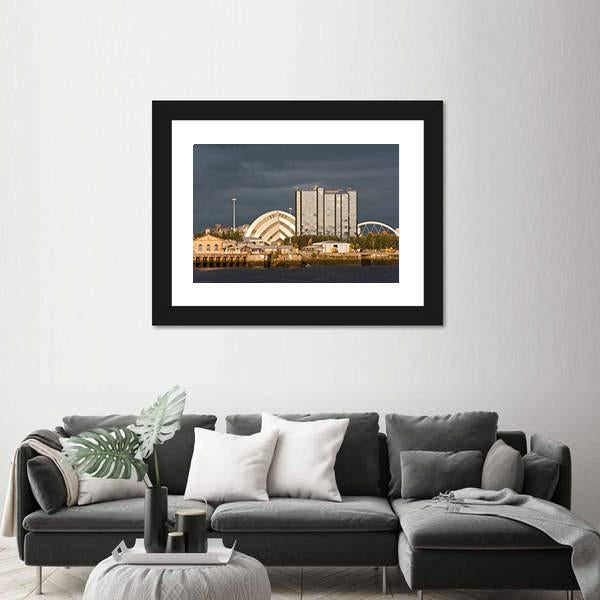 Sunlight On Buildings As Storm Clouds Canvas Wall Art-1 Piece-Framed Print-20" x 16"-Tiaracle
