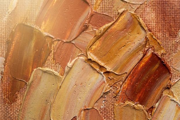 Abstract warm canvas artwork in close up