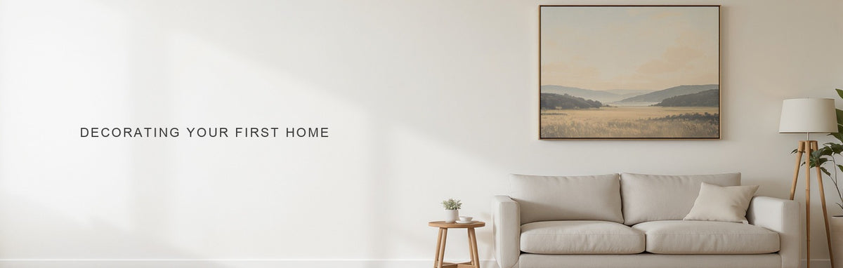Decorating your first home: one canvas print above a linen sofa in a simply furnished room