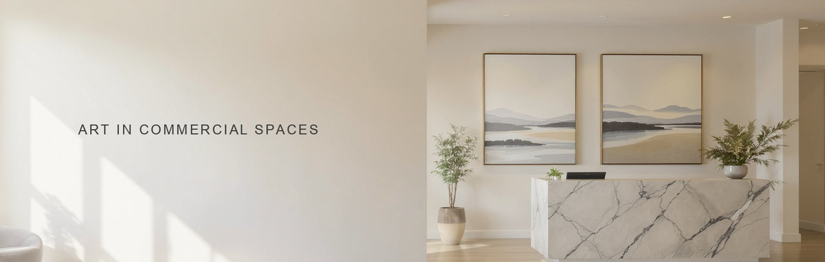 Canvas art in commercial spaces: large abstract landscape canvases behind a pale stone reception desk