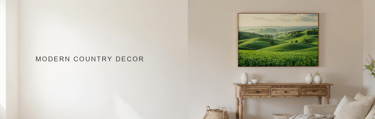 Modern country decor: a rolling farmland canvas above a reclaimed wood console under an exposed beam