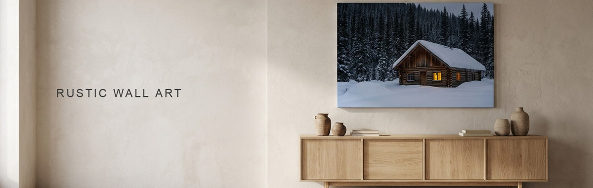 Rustic wall art above a sofa, a snowy log cabin photograph on canvas
