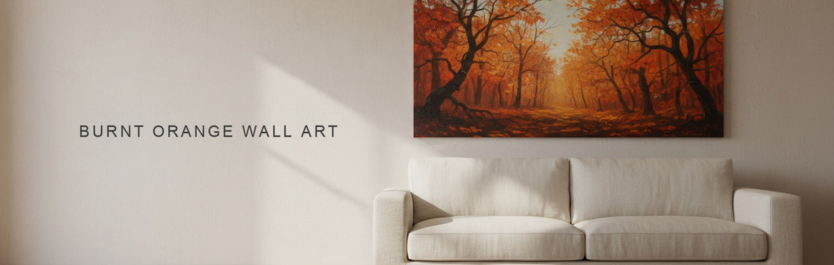 Burnt orange wall art above a sofa, an autumn forest at low sun on canvas