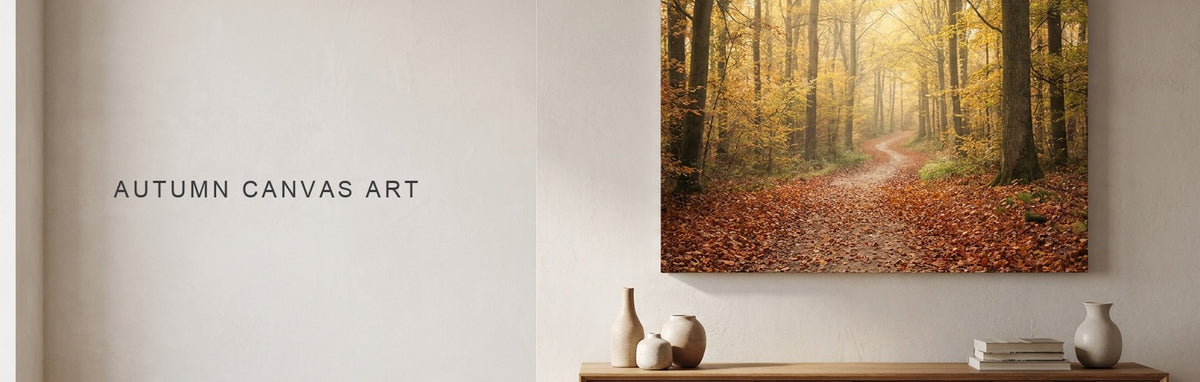 Autumn canvas wall art of a golden forest path above a sofa
