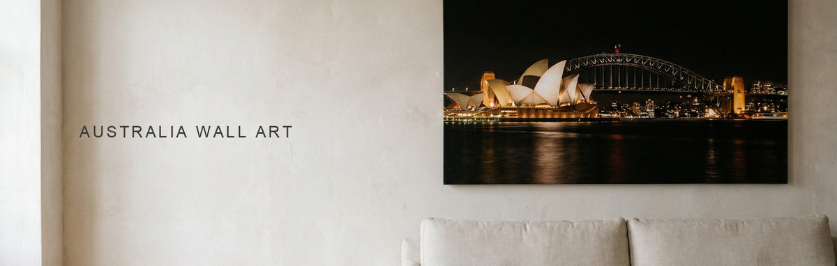 Australia wall art of Sydney Harbor at night above a sofa