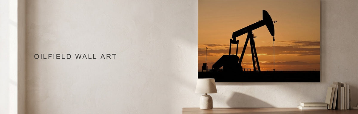 Oilfield wall art of a pump jack silhouetted at sunset above a desk