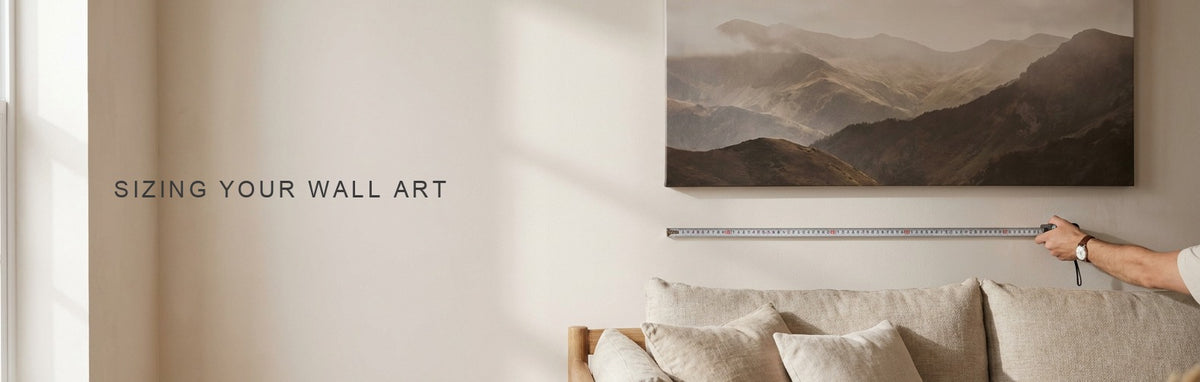 A wall art size calculator sizing a canvas against a real sofa in a living room