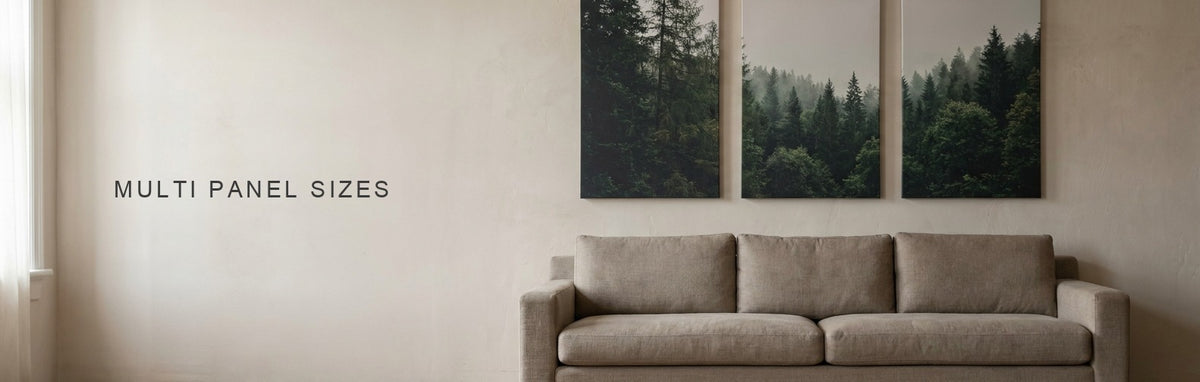 Multi panel canvas sizes, a three panel canvas set above a long sofa