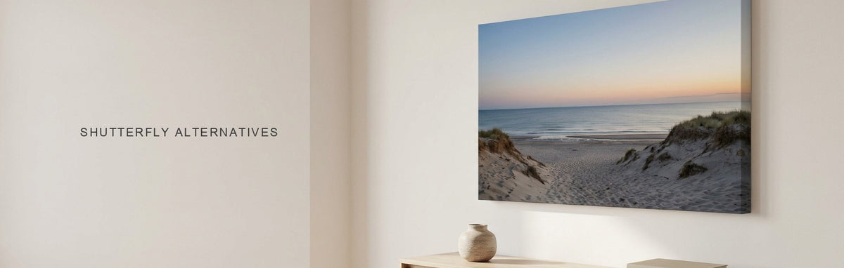 Shutterfly alternatives, a large coastal beach canvas print at dusk above a white oak console in a bright living room