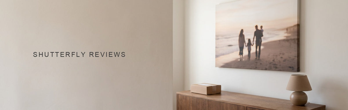 Shutterfly reviews, a gallery-wrapped family seaside canvas on a plain wall above a sideboard with a shipping box
